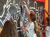 Artists Add to Mural