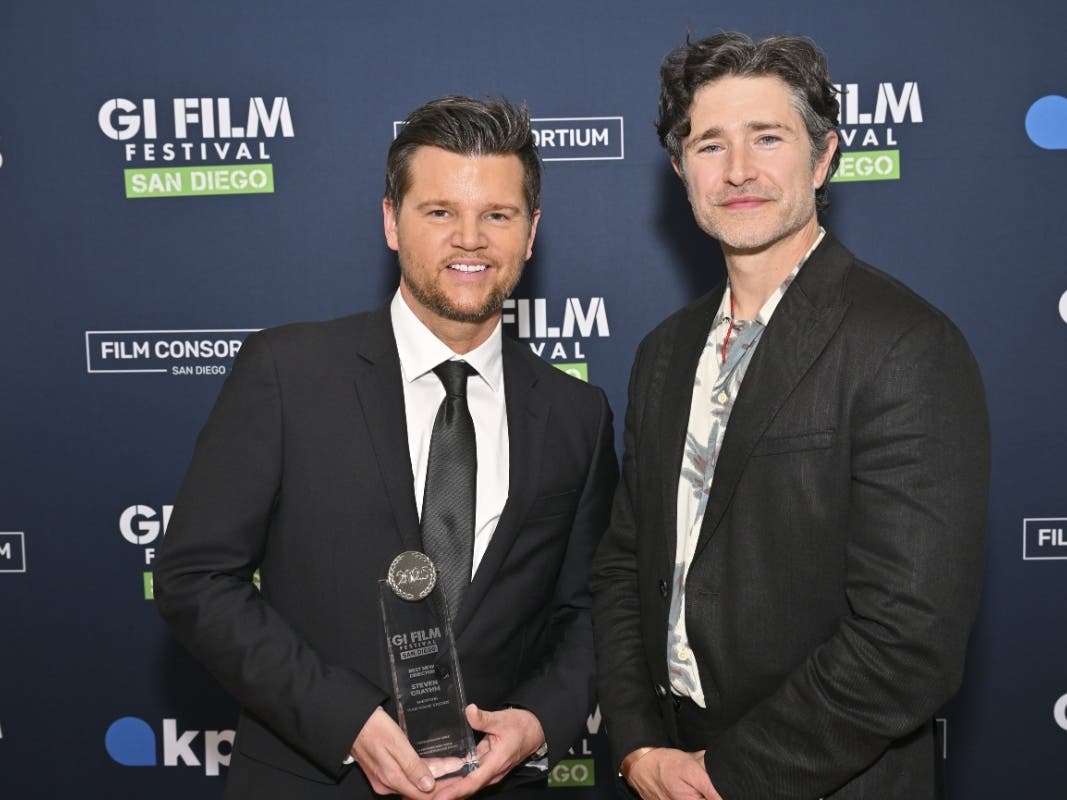 (Left) Writer, director and actor of award-winning "SHEEPDOG" narrative feature Steven Grayhm and (right) actor Matt Dallas at Opening Night of the 2025 GI Film Festival San Diego.