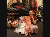 North Shore Civic Ballet trustee, Rosemary Grant, shows some of the pajamas and winter coats collected in the 2022 clothing drive to help neighbors in need in the area.