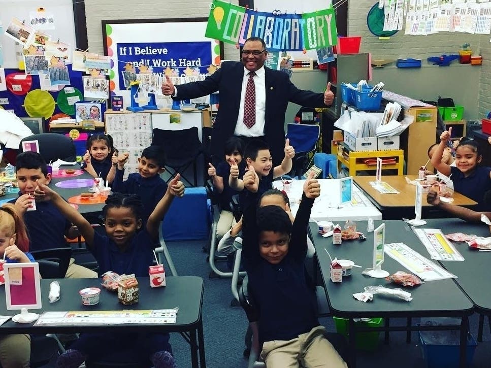 Pictured is Missouri State Rep. Richard Brown with first graders from Kansas City Public Schools.