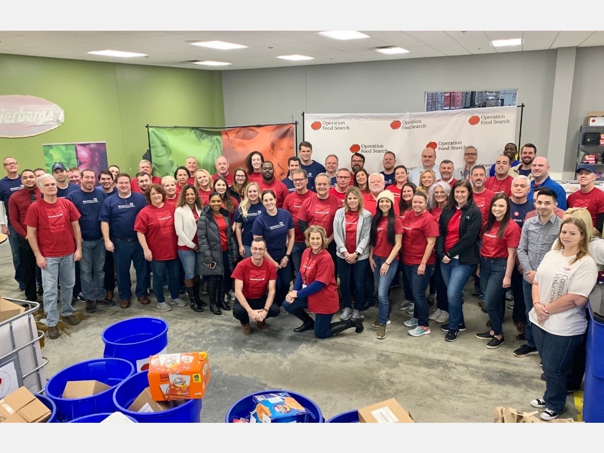 Pictured are Bank of America team members volunteering their time to pack food prior to the pandemic.