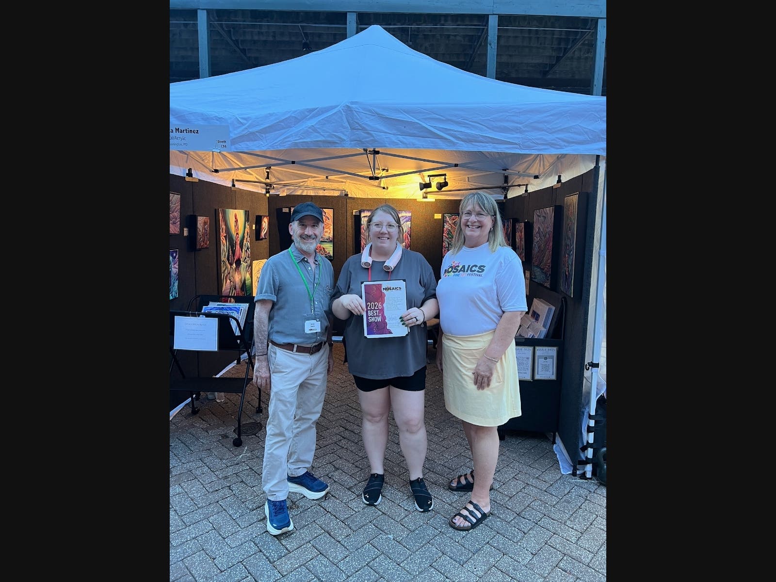 Pictured from left to right are artist festival judge Brian David Smith, Best of Show winner Jessica Martinez and Mosaics Fine Art Festival president Denise Wulff.