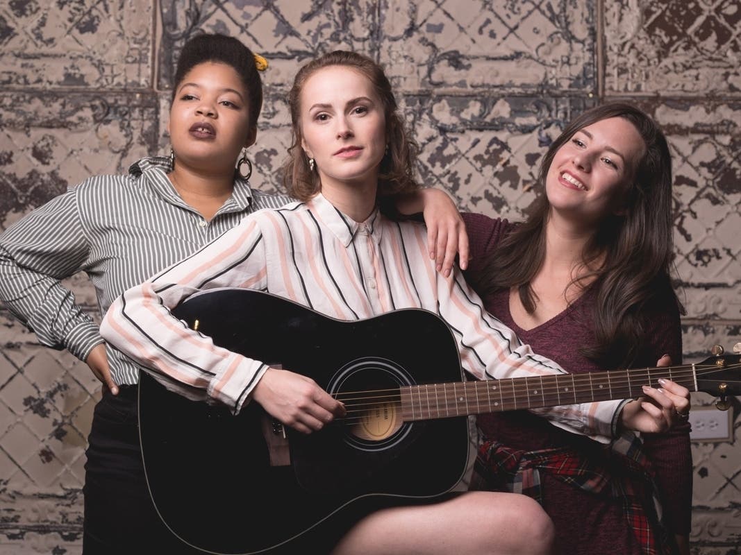Lena Dudley, Charlie Irving and Kelly Combs in a publicity image for New American Folk Theatre’s world premiere musical MY LIFE IS A COUNTRY SONG.  