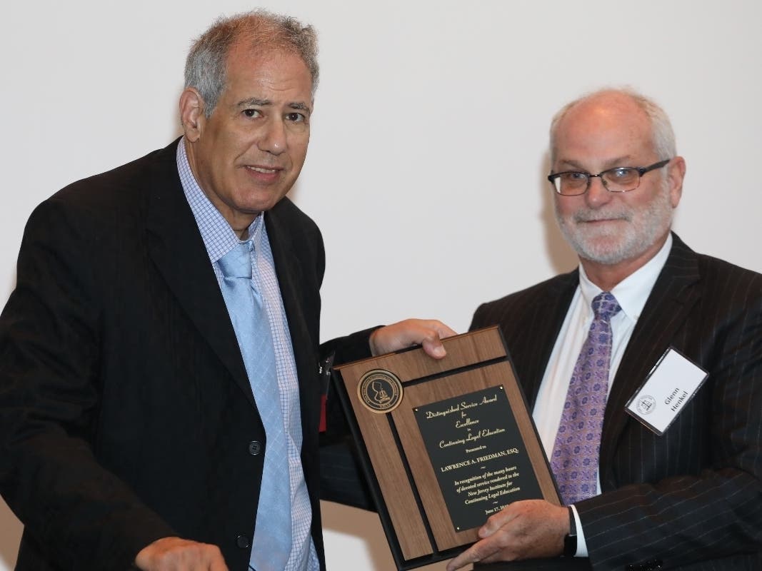 Lawrence A. Friedman, Distinguished Service Award recipient and Glenn A. Henkel, CLE Advisory Committee Chair.