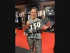 A member celebrates her 150th class.