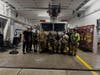 Photo cutline information: Ship Bottom Fire Volunteers Kevin Hayes (fifth from left, holding helmet) with other Ship Bottom volunteer firefighters.