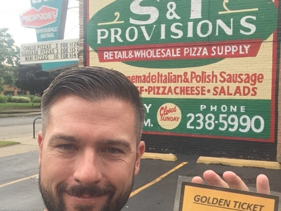 Brian Giaretta holds the golden ticket that will be on the loose during the July 27 scavenger hunt.