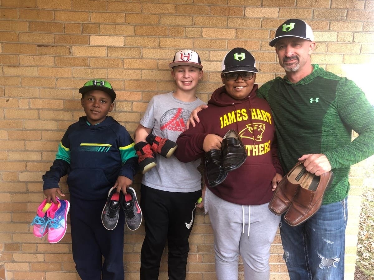 Jhames and Matthew Holley with the president of the club Mr. Brian Andreatta and his son, Giancarlo.