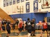 Members of the Chicago Heights police and fire departments faced off in a basketball game for charity on Sunday.
