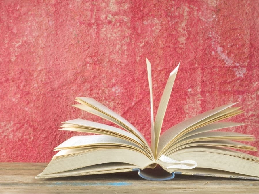 Open Book and cup of coffee, reading, learning, education concept, panoramic format, good copy space 