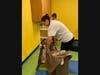 Volunteers empty out the playroom to make room for new items