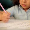 Students at Asian Youth Services are required to work on homework at the after-school program before participating in other activities.
