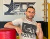 A five-time martial arts champion, Christian Defiris strikes a pose in ECF Elite Martial Arts & Fitness in Oceanside, his gym that he relocated from Lynbrook in August.