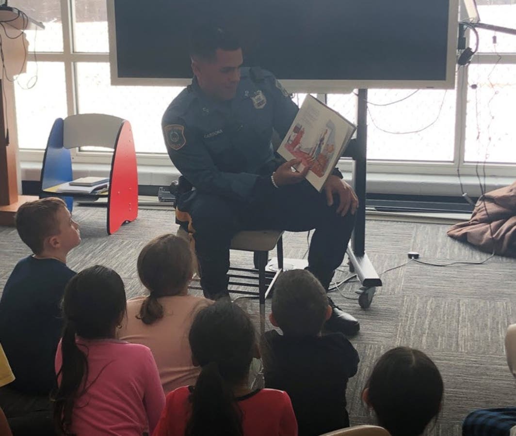 South End School invited a Cedar Grove police officer to read to 2nd graders.