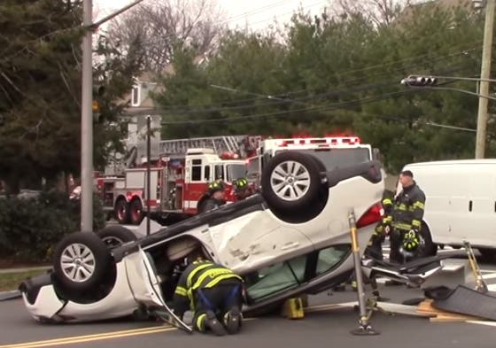 A Montclair woman was left hanging upside down by her seatbelt after a rollover crash, police said.