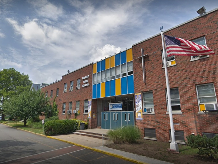 High winds caused a tent to blow over at Marist High School in Bayonne, NJ. Four were hurt, police said.