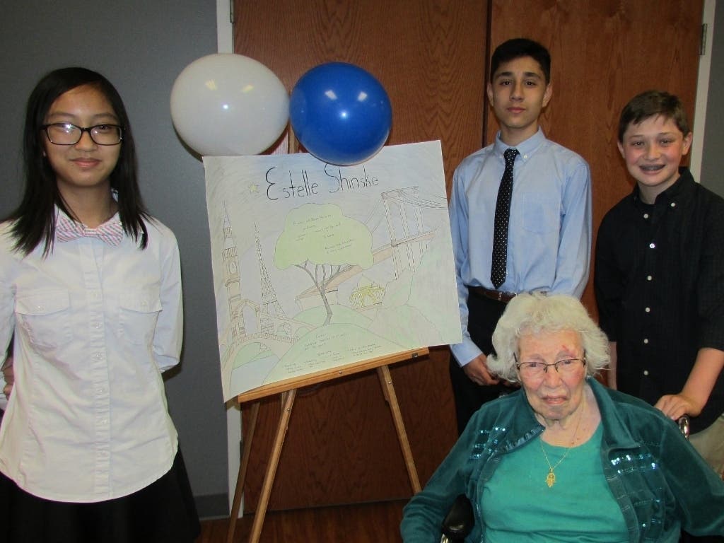 Daughters of Israel resident Estelle Shinske poses with West Orange High School students.