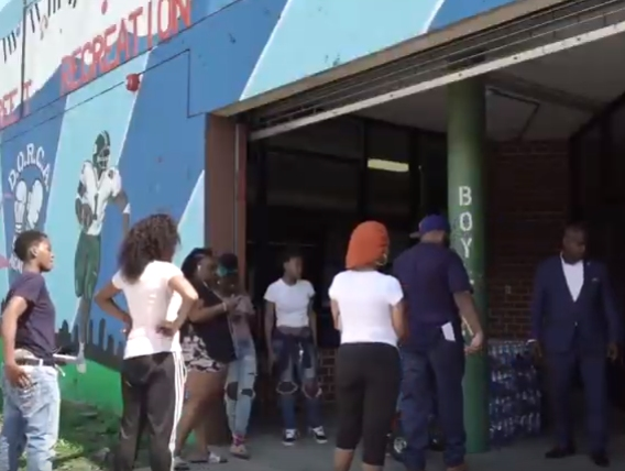 Local residents line up to get bottled water as Newark continues to deal with lead contamination in the city.