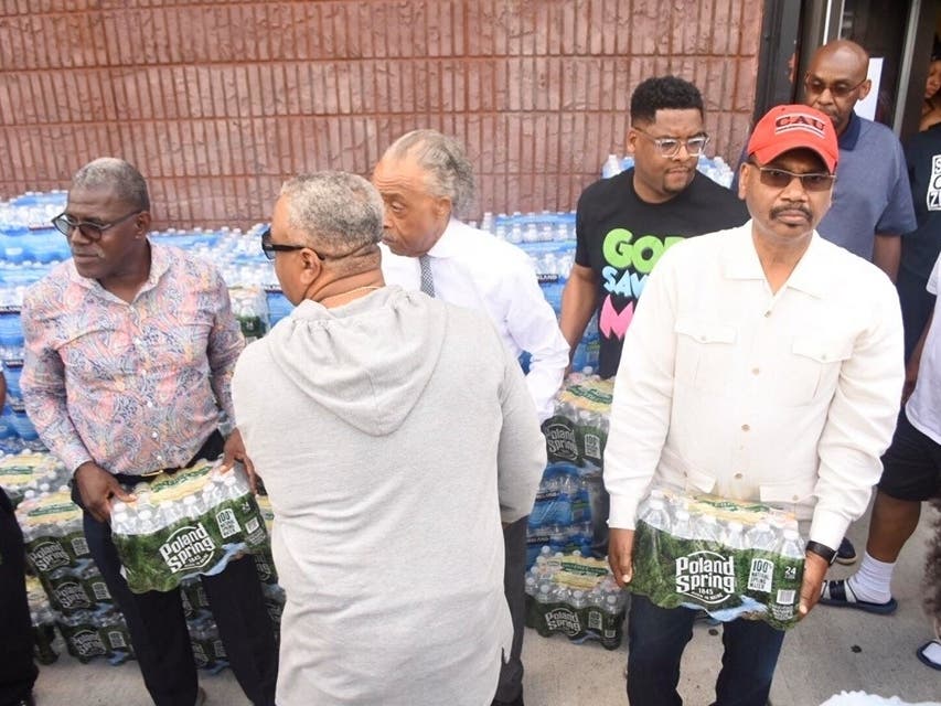 The Rev. Al Sharpton visits Newark to hand out bottled water in August 2019.