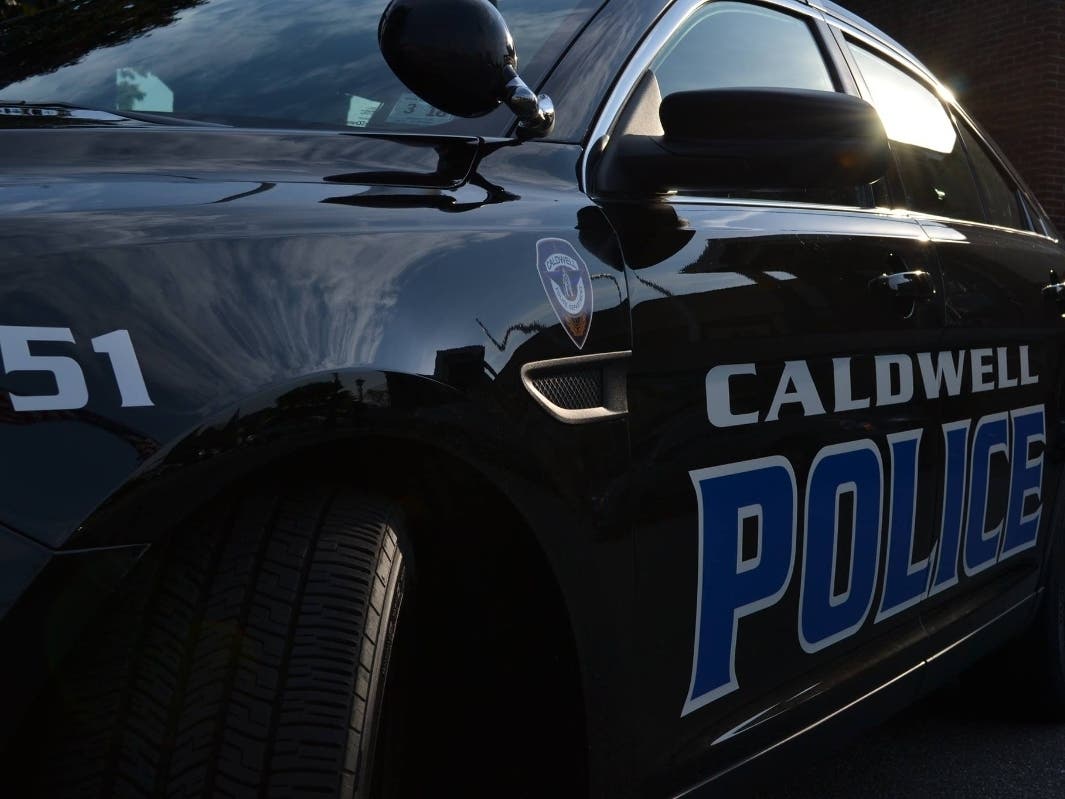 A pair of police officers in Caldwell have settled lawsuits against their chief and the township for $240,000, reports say.