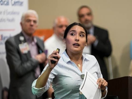 Sarah Bonilla, MPH, Program Manager, presents an overview of the Center of Excellence for Latino Health at Clara Maass Medical Center to local leaders within the Latino community.