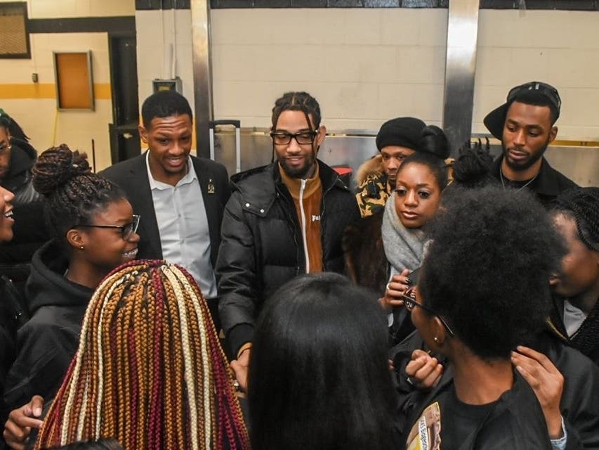 Hip-hop artist PnB Rock surprised dozens of Newark students with free tickets to his concert in Montclair, NJ.