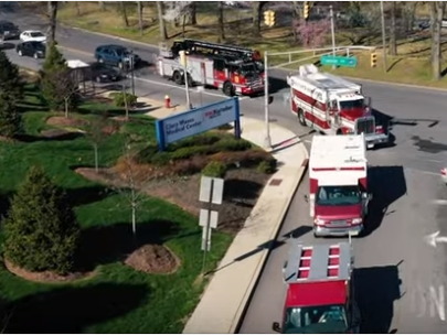 A caravan of police, fire and EMS workers offer a show of support to health care workers at Clara Maass hospital in Belleville.