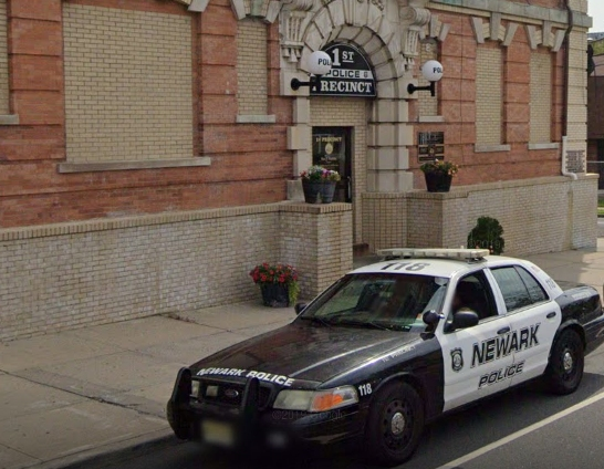 A pair of men have been accused of vandalizing police vehicles during an otherwise peaceful protest in Newark, authorities said.