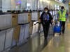 Mandatory face masks and vending machines loaded with hand sanitizer are part of the new travel routine at Newark Airport.