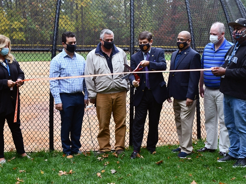 Officials hold a ribbon cutting ceremony to mark the grand reopening of Tuers Park in Montclair, NJ after making extensive improvements.