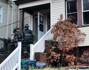 Newark firefighters rescued an arson suspect from a rooftop during a blaze on Wednesday, authorities said.