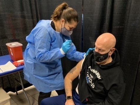 Newark Public Safety Director Anthony Ambrose gets a COVID-19 vaccination on Saturday.