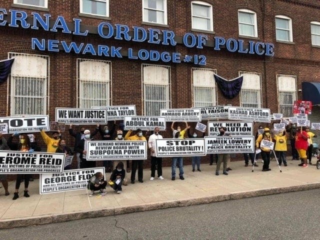 Activists and community members rally outside the Newark Headquarters of the Fraternal Order of Police in October 2020.