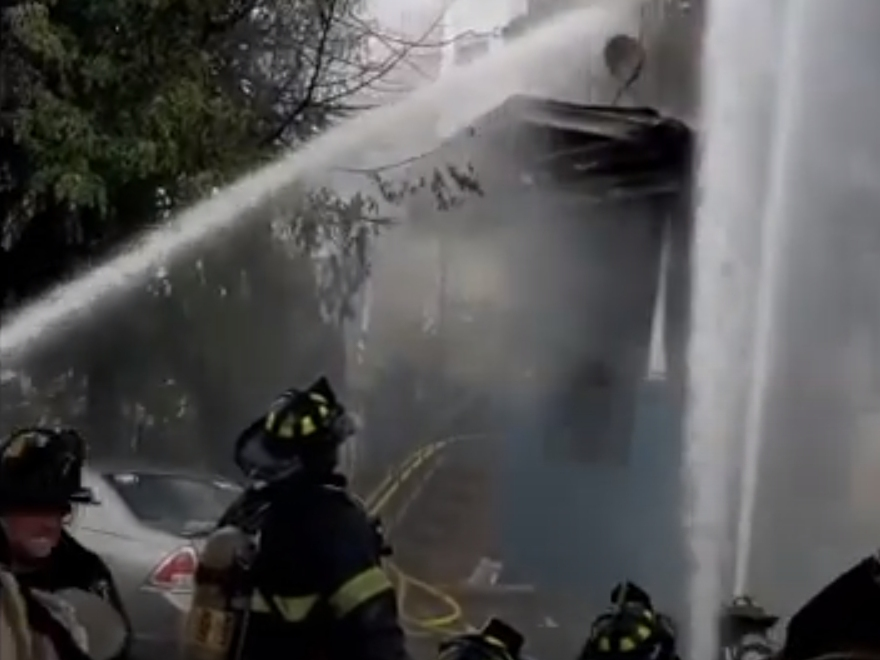 A Newark firefighter suffered second-degree burns while battling a house blaze on Wednesday.