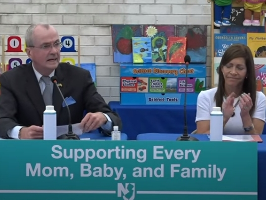 New Jersey Gov. Phil Murphy and first lady Tammy Murphy speak at a news conference in Newark on Thursday to announce the signing of a state law that will provide newborns with a home visit from a registered nurse.