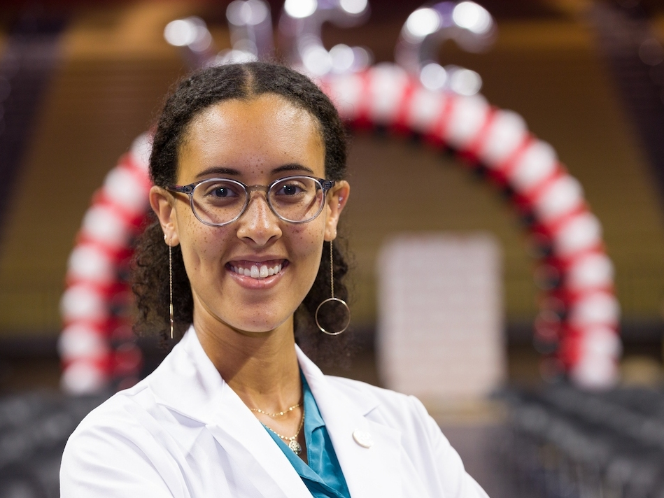 As a new student at Rutgers Robert Wood Johnson Medical School, Hassiet Asberom recently adorned a white coat for the first time, symbolizing the start of her journey to becoming a physician.