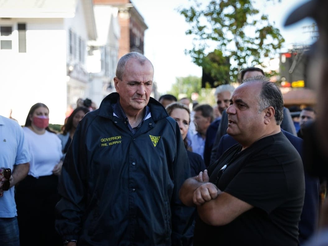 Gov. Phil Murphy tours a street in Millburn, NJ on Thursday, a day after Tropical Storm Ida caused widespread flooding in the state.