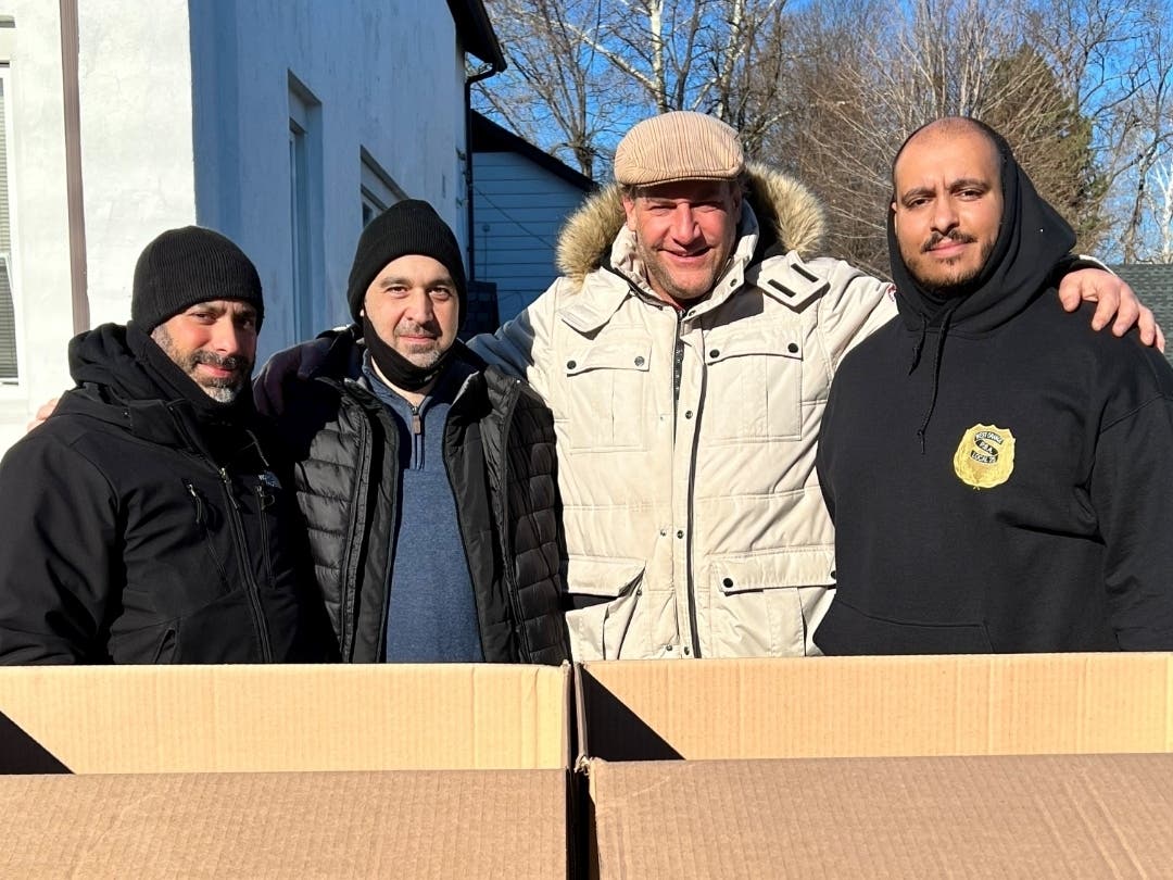(L-R) WOPD/WOPBA Officer Jason Padilla, WO 411 Dispatcher and long-time pantry volunteer Scott Manginelli, former Giants player and NFL Alumni Association member Christian Peter, and WOPD/WOPBA President Lawrence Dominguez.