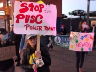 Activists and residents rally in Newark, NJ in November 2021 against a pair of proposed projects in the city, including the Passaic Valley Sewerage Commission’s plan to build a new power plant in the Ironbound neighborhood.
