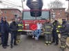 Delaney Deleon, who recently turned 13, has been credited with saving his family from a house fire that took place last December. Above, Deleon and his brother pose for a photo after getting a surprise visit from local firefighters and police.