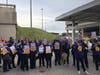 On Wednesday, workers at JFK, LaGuardia and Newark Airport joined a national day of action that took place in more than 20 cities.