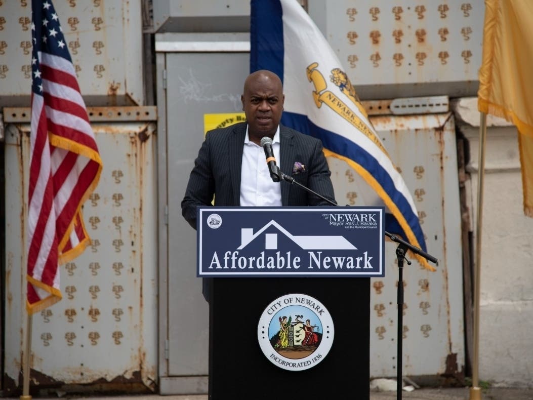 Mayor Ras Baraka and other community leaders gather at a news conference in May 2022 to give an update about the Affordable Newark project. The housing initiative is targeted at Newark families earning 30% of the area median income for a family of four.