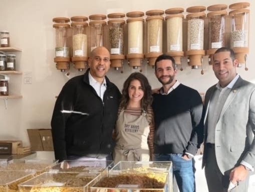 U.S. Sen. Cory Booker and Montclair Mayor Sean Spiller visit Dry Goods Refillery, a "plastic-free grocery store" in Montclair, New Jersey.