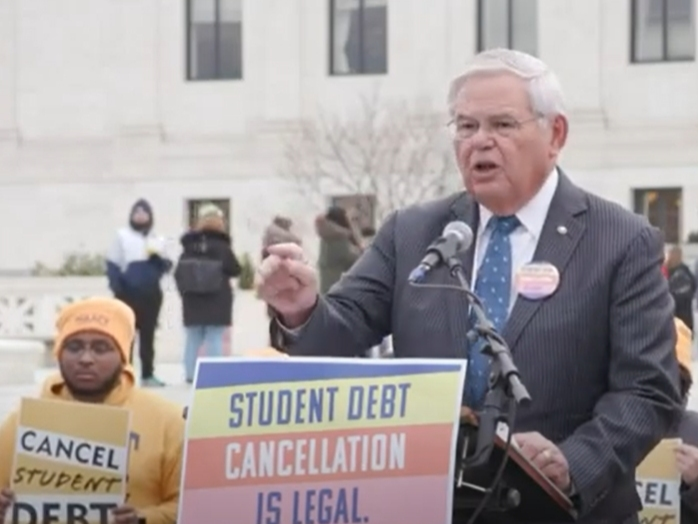 U.S. Sen. Robert Menendez of New Jersey joins students, parents and advocates at a rally outside the Supreme Court on Tuesday.