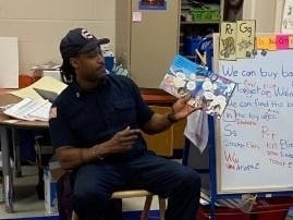 Newark firefighters recently put down their gear and picked up some books, reading to more than 1,000 kids across the city as part of a series of community events.