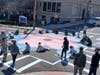 Last week, nearly two dozen members of the Belleville High School Arts Club rolled up their sleeves and used temporary paint to leave a massive cherry blossom at the intersection of Holmes and High streets in Belleville, NJ.