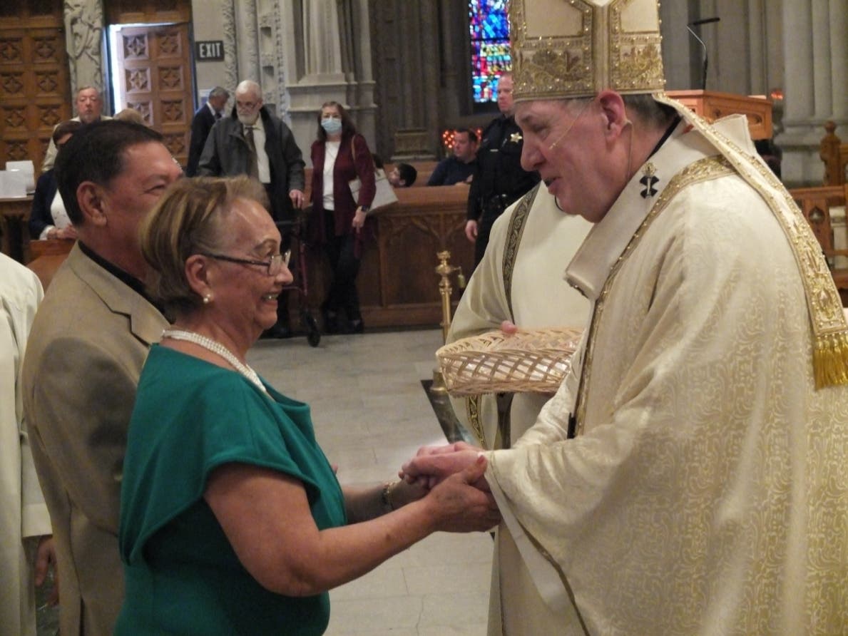 Cardinal Joseph Tobin congratulates a couple celebrating more than a half-century of marriage following the Archdiocese of Newark’s annual Golden Anniversary Mass at Cathedral Basilica of the Sacred Heart on April 16, 2023.