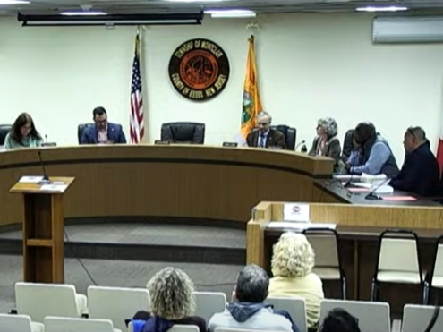 Members of the Montclair Town Council vote on a resolution to permanently remove former township manager Tim Stafford on April 28, 2023.