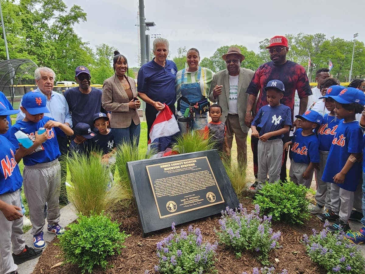 Newark resident Houston Stevens (wearing a tan hat) stands alongside family members and local officials at a dedication ceremony in Ivy Hill Park on May 13.
