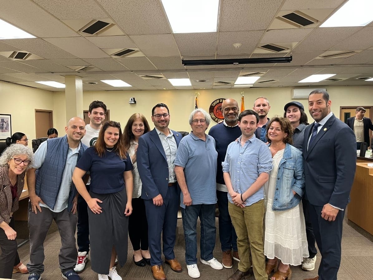 The owners of Kush Connection pose for a photo after the Montclair Town Council meeting on May 16.